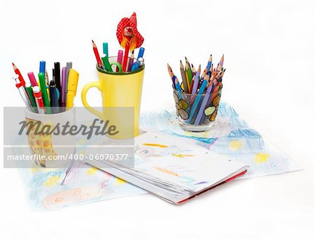 Abstract painting  and pen holders  with colored pens on a white background