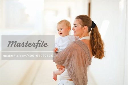 Mother and baby looking on copy-space