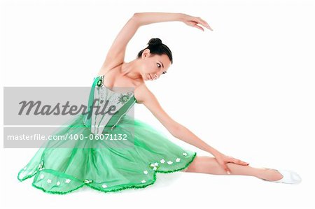 Exercising ballerina in green dress isolated on white background