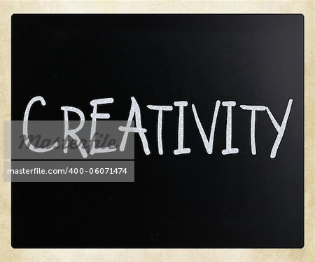 The word "Creativity" handwritten with white chalk on a blackboard
