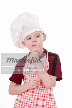 a pensive child chef isolated on white background