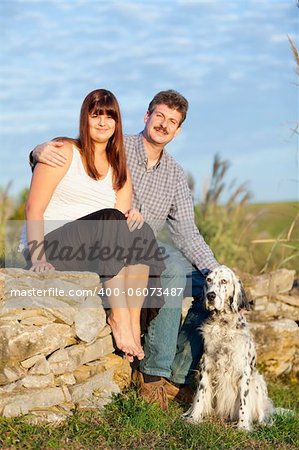 Outdoors portrait of father, daughter and the dog