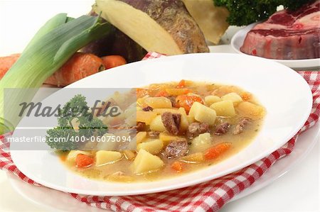 a plate of turnip stew with parsley and cook meat