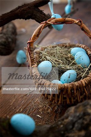 Easter decoration background with blue eggs on wooden background