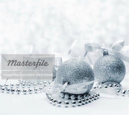 Silver christmas ornaments with bokeh background