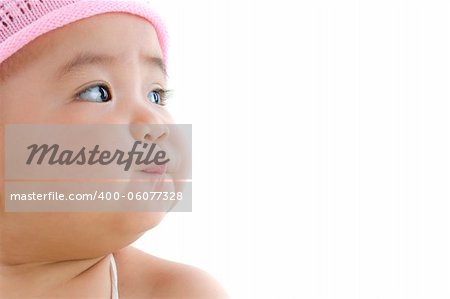 Close up beautiful 10 month old pan asian baby girl in pink flower hat