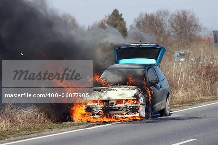 burning car on the road