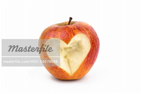 Red apple with a bite with a shape of a heart