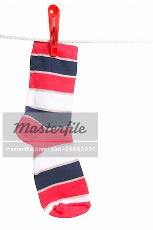 One striped sock hanging on the clothesline. Image isolated on white background