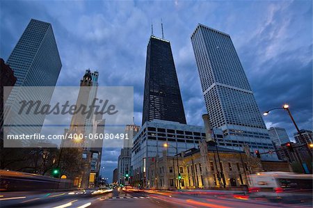 Image of busy traffic at the street of Chicago during  sunset blue hour.