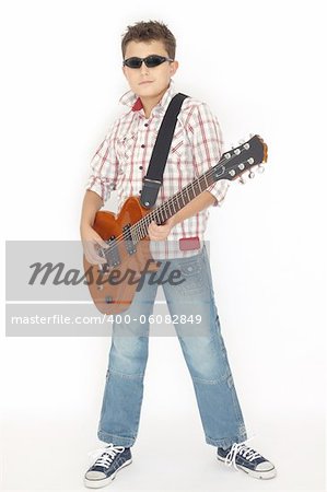 Boy playing with a guitar over white