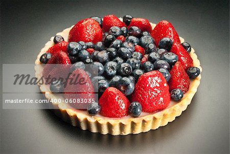 dessert fruit cake with strawberries and blueberries