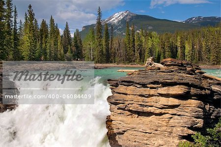 Falls in the rugged mountain river in the Canadian Rockies