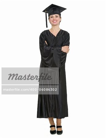 Full length portrait of woman in graduation cap and gown. HQ photo. Not oversharpened. Not oversaturated