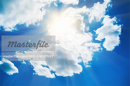 Blue sky with clouds and sun