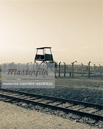 Scenery from Auschwitz with a tower and railway line
