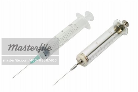 Disposable and old glass syringes against white background