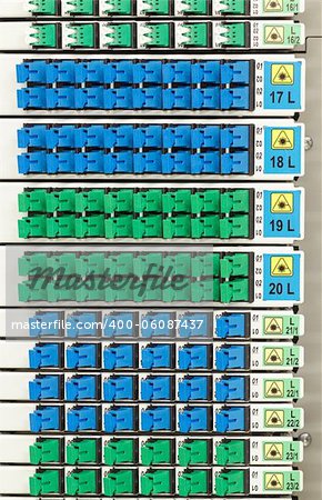 fiber optic cable management system with green and blue SC connectors