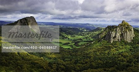 Beautiful rocky volcanic landscape in The Central Massif in France. The image represents The Tuiliere Rocks (left) and The Sanadoire Rocks (right) and between these there is The Chausse Valley.