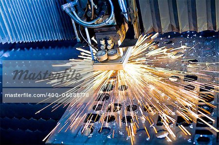 Laser cutting with sparks close up