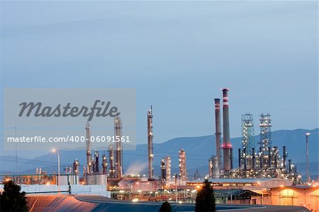 Panoramic view of an oil refinery at night