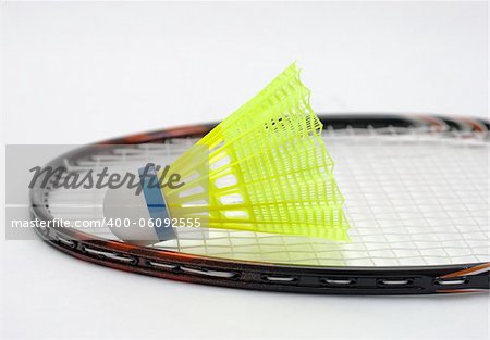 Badminton racket and shuttlecock on white background