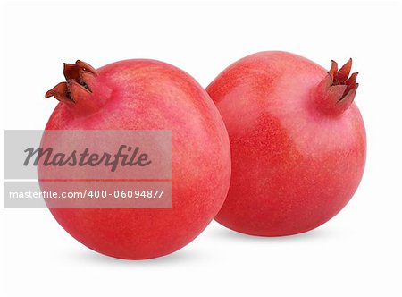 Two ripe pomegranate fruits isolated on white background