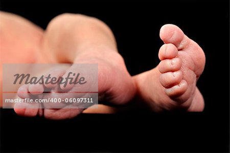 The little bare feet of a new born baby