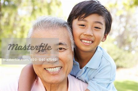 Grandfather With Grandson In Park