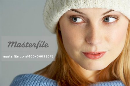 Portrait Of Young Woman Wearing Winter Clothes