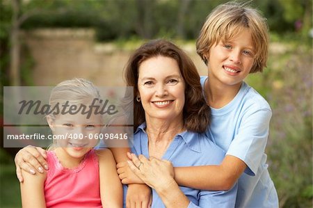 Grandmother With Grandchildren In Garden