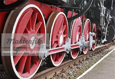 Close up shot of wheels of the old locomotive