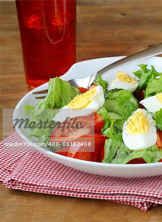 salad with eggs and  fresh vegetables,  on a plate