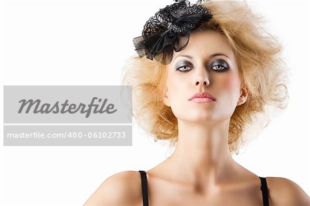 hair style with black accessory of a very beautiful blond girl wearing a black bra lingerie, she is in front of the camera and looks in to the lens with serious expression