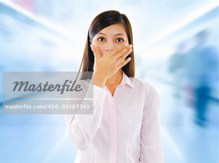 Asian woman with big surprise expression, hand covering mouth