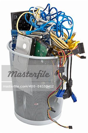 electronic scrap in trash can. keyboard, power supply, cables, logicboard, hard drive - isolated on white background