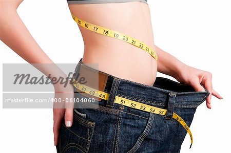 Woman seen how much weight she lost. Isolated background.