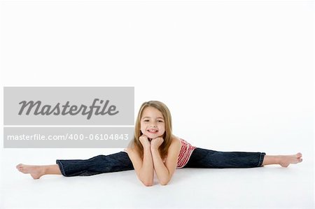 Young Girl In Gymnastic Pose Doing Splits