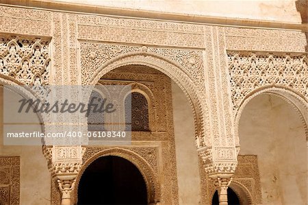 Detail of arabic carvings at Nasrid Palaces in the Alhambra of Granada in Andalusia, Spain