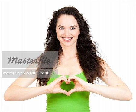 Beautiful young woman making a love heart with hands. Isolated over white.