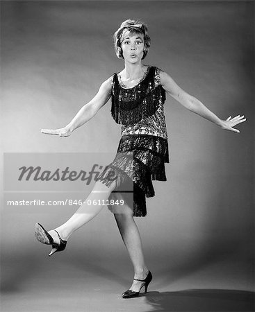 1960s WOMAN IN FLAPPER COSTUME DANCING