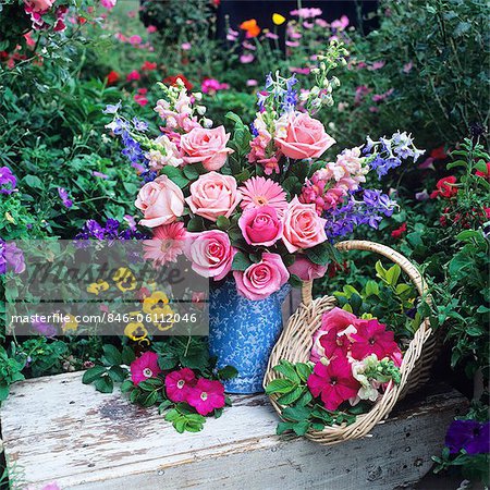 FLOWER ARRANGEMENT WITH ROSES IN GARDEN SETTING