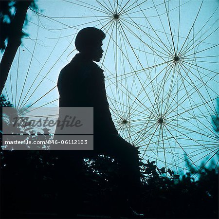 SILHOUETTE OF AFRICAN-AMERICAN MAN OUTDOORS