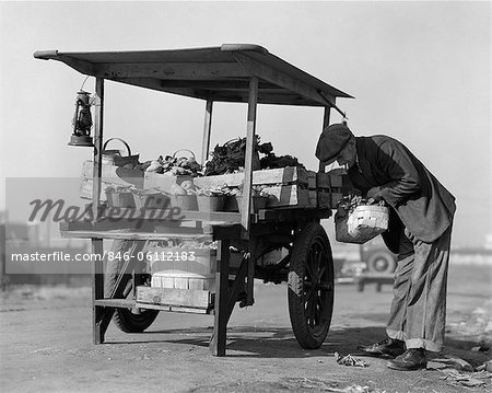 1930s 1940s GROCER OUTDOORS AT VEGETABLE CART