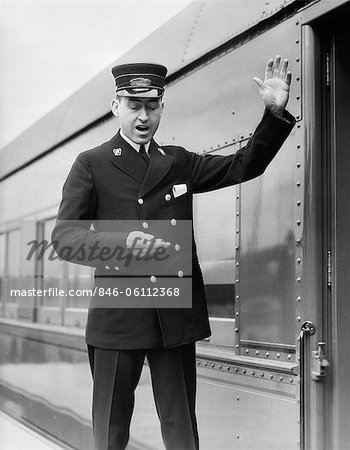 1930s CONDUCTOR MAKING FINAL BOARDING CALL OUTSIDE TRAIN