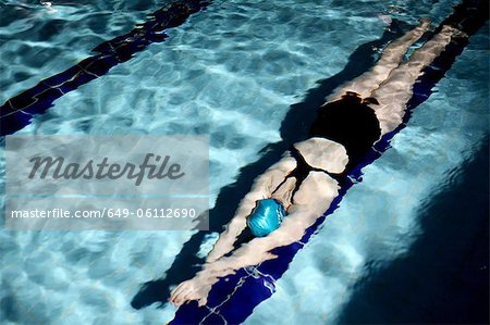 Swimmer doing laps in pool