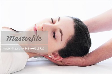 Woman having scalp massage in spa