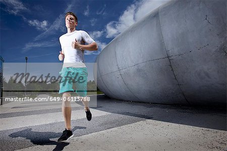 Man running in industrial area