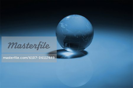 Crystal globe on blue background