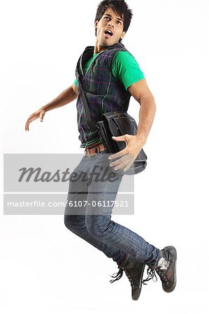 Young man jumping with joy